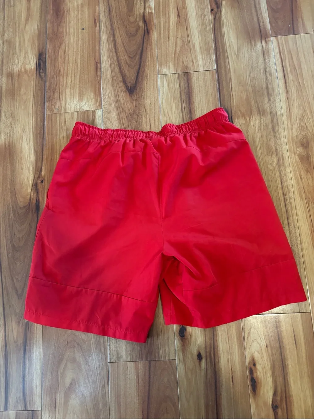 c-1 Nike Men’s Bright Red Athletic Shorts with White Swoosh.